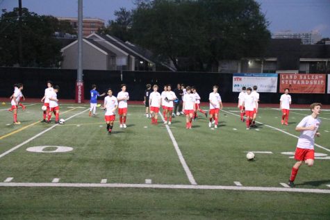 The JV squad just finished pregame warm ups and is ready to take it to the pitch for their home opener. 