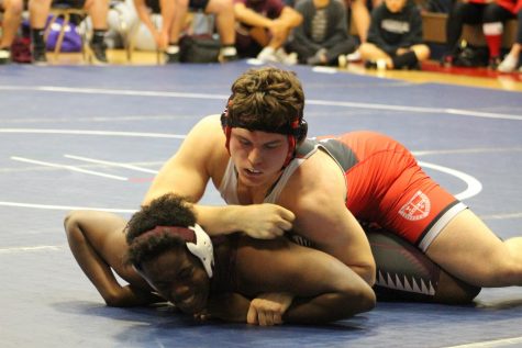 Jackson Phillips works to dominate his opponent in the Clear Lake Dual.