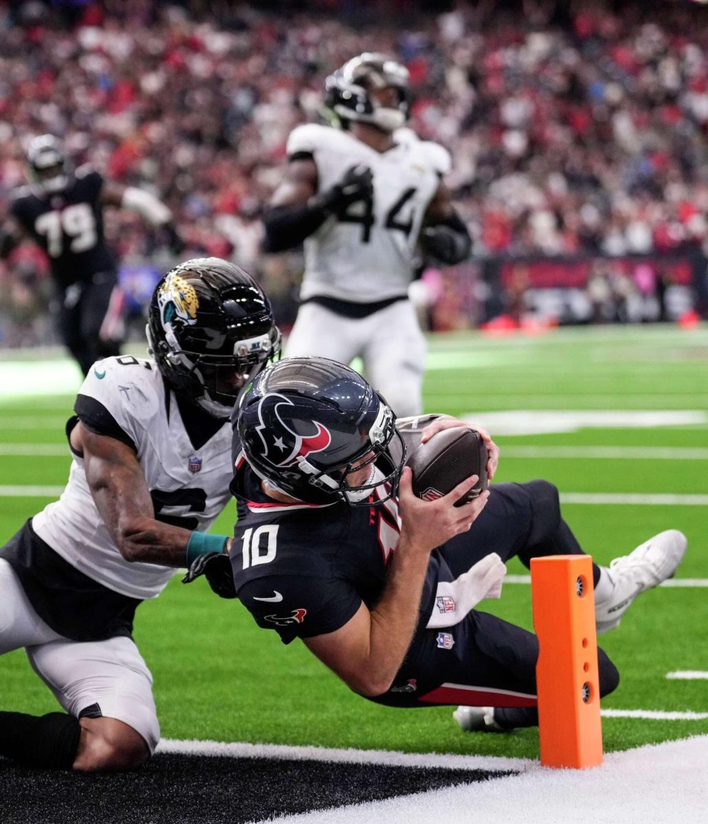 Davis Mills fights across the goal line against Jacksonville.